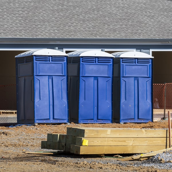 what is the cost difference between standard and deluxe portable toilet rentals in Petros